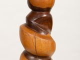 a wooden sculpture that is stacked on top of each other