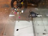 a glass table that has a motorcycle on top of it