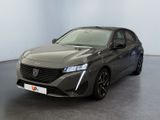 vue de face d'une voiture de couleur sombre dans une pièce blanche
