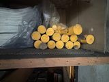 a stack of yellow discs on a shelf in a room