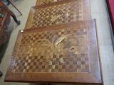 a wooden table with a chess board on top of it