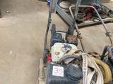 a machine that is sitting on a pallet in a garage