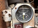 a close up view of a gauge on a machine