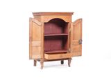 une armoire en bois dont la porte est ouverte, sur fond blanc