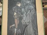 a person holding a picture of a woman and a dog