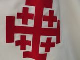 a white shirt with a red cross on it