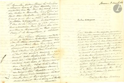 an old handwritten letter is open on a piece of paper
