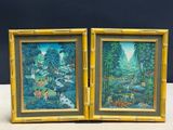 pair of framed paintings of a jungle scene with animals and trees