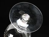 a wine glass with a wine bottle inside of it