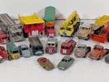 a lot of toy cars and trucks on the floor