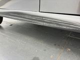 a close up of a car ' s rear end with a sticker on it