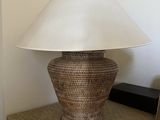 a lamp that is sitting on a table next to a mirror