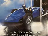 a poster of a race car on display in a store