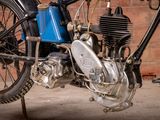 a close up of a motorcycle with a blue engine