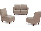 four pieces of furniture including a couch, chair, and ottoman