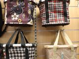 many bags hanging on a wall in a store