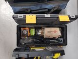 a tool case with tools in it sitting on the floor