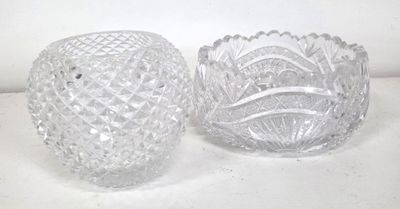 two glass vases that are sitting on a table
