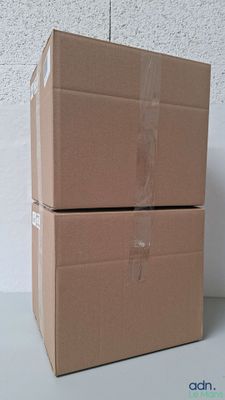 two boxes stacked on top of each other on a table
