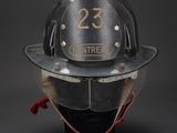 a fireman ' s helmet with the number 23 on it