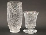 two vases sitting next to each other on a table