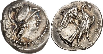 a silver coin with an image of a bird on it