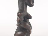 an image of a statue of a woman holding a baby