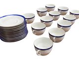 a lot of cups and saucers sitting on a table