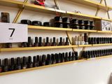 many bottles of nail polish on the shelves in the store