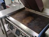 a large oven that is sitting in the middle of a kitchen