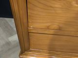 an image of a wooden dresser with three drawers