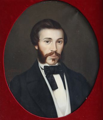 portrait of a man in a tuxedo with a beard and a bow tie