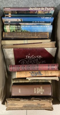 a lot of books in a box on the floor