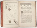 an old book opened to show a diagram of the structure of a telescope