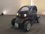 a small car that is parked inside of a building