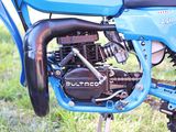 a close up view of a motorcycle engine on a dirt bike