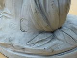 a statue of a woman with a veil on it ' s head