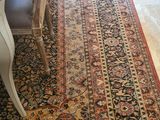 a long rug that is on the floor in the room