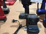 two corded drillers sitting on a table with a price tag on it