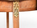 a small wooden table with a marble top on it
