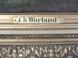 a close up of a sign on a gold frame
