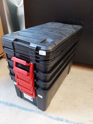 a black box with a red handle on top of it