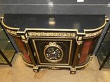 a black and gold cabinet with a clock on it