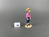 a small figurine of a man with a hat and a cane