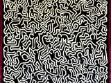 un gros plan sur un tapis noir et blanc bordé de rouge