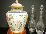 three vases and a small vase on a table