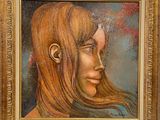 tableau représentant le visage d'une femme aux longs cheveux, dans un cadre doré