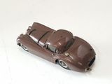 a toy car that is sitting on a white surface