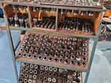 many different types of tools on a cart in the shop