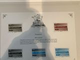 a shadow of a person standing in front of a picture of a train